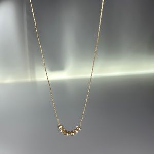 7 small beaded gold choker like necklace. not for bigger necks